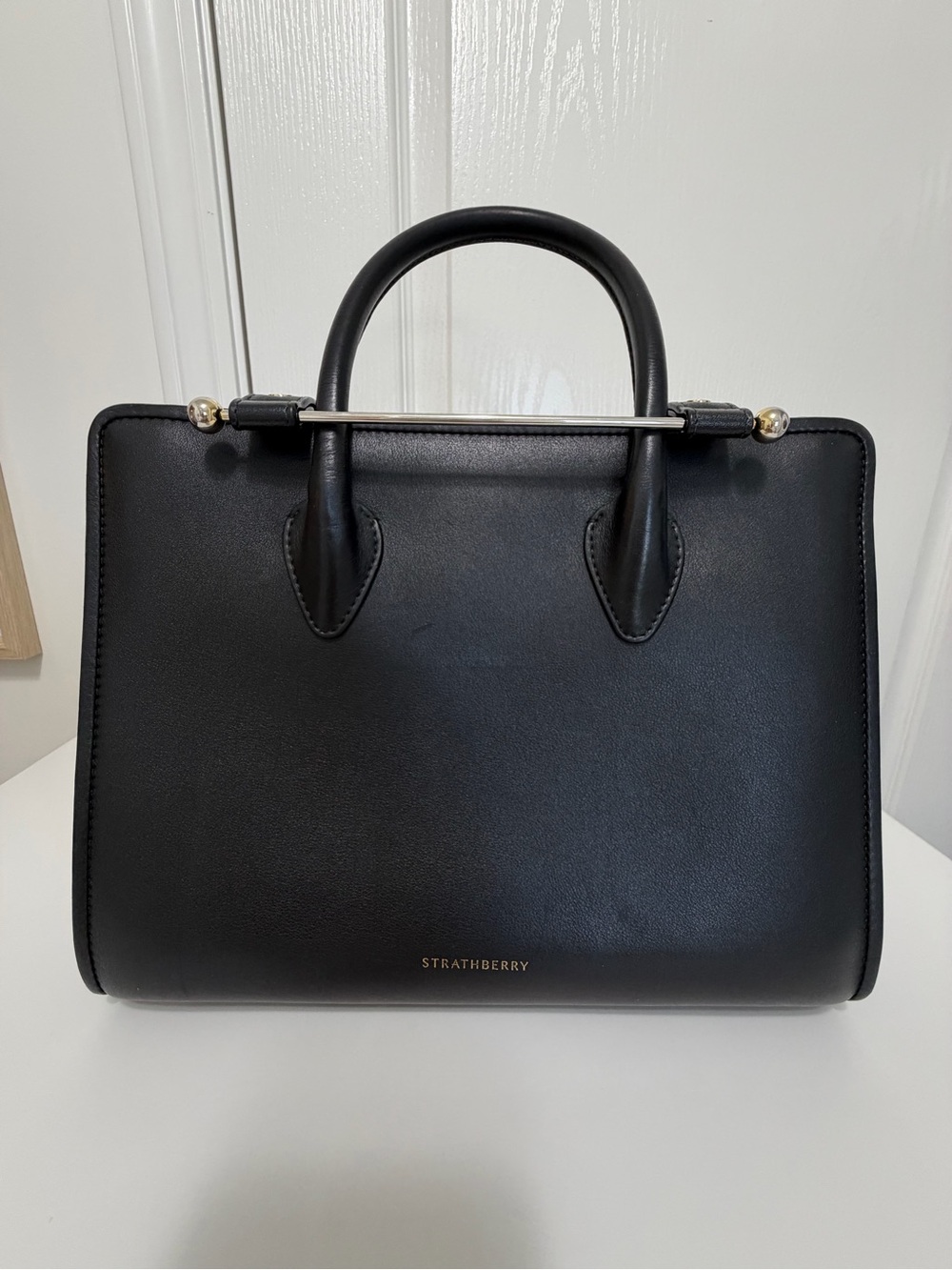 Strathberry Black Structured Top-Handle Satchel with Gold Accent
